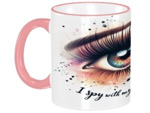 A pink-handled ceramic mug displays an eye illustration with the text "I Spy2." A pink-handled ceramic mug displays an eye illustration with the text "I Spy2." A pink-handled ceramic mug displays an eye illustration with the text "I Spy2."