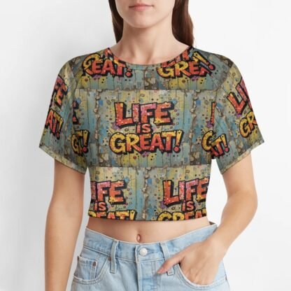 "Life Is Great!" all-over printed Women`s Short T-Shirt in greenish gray background with yellow and muted red letters with bold black outlines in a graffiti style
