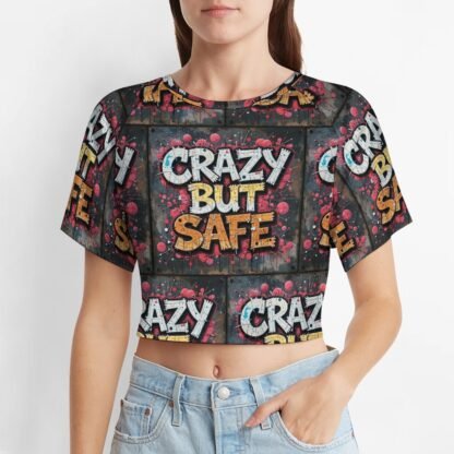 "Crazy But Safe" 2 Women's Short T-Shirt with an all-over print in graffiti style in dark gray background with yellow and white letters with bold black outlines and pink shadows