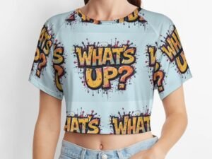 "What`s Up?"2 Women`s Short T-Shirt with all-over print in graffiti style in pale blue background with yellow/orange letters with bold black outlines